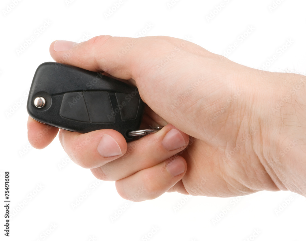 Hand holding car keys isolated on white background Hand holding car keys isolated on white background