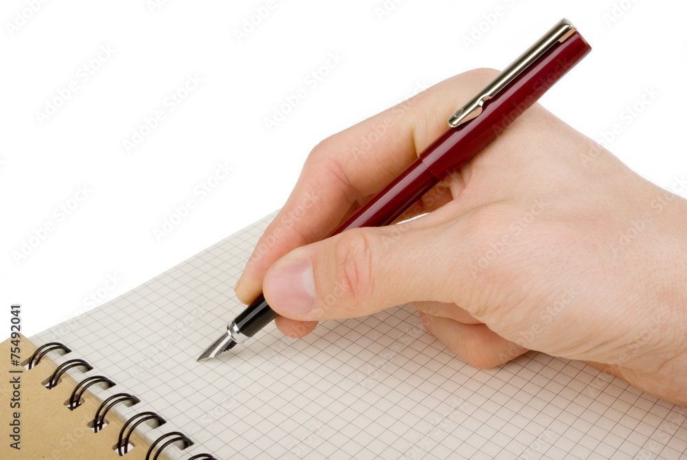 Hand writing on empty notepad (notebook) isolated on white Hand writing on empty notepad (notebook) isolated on white