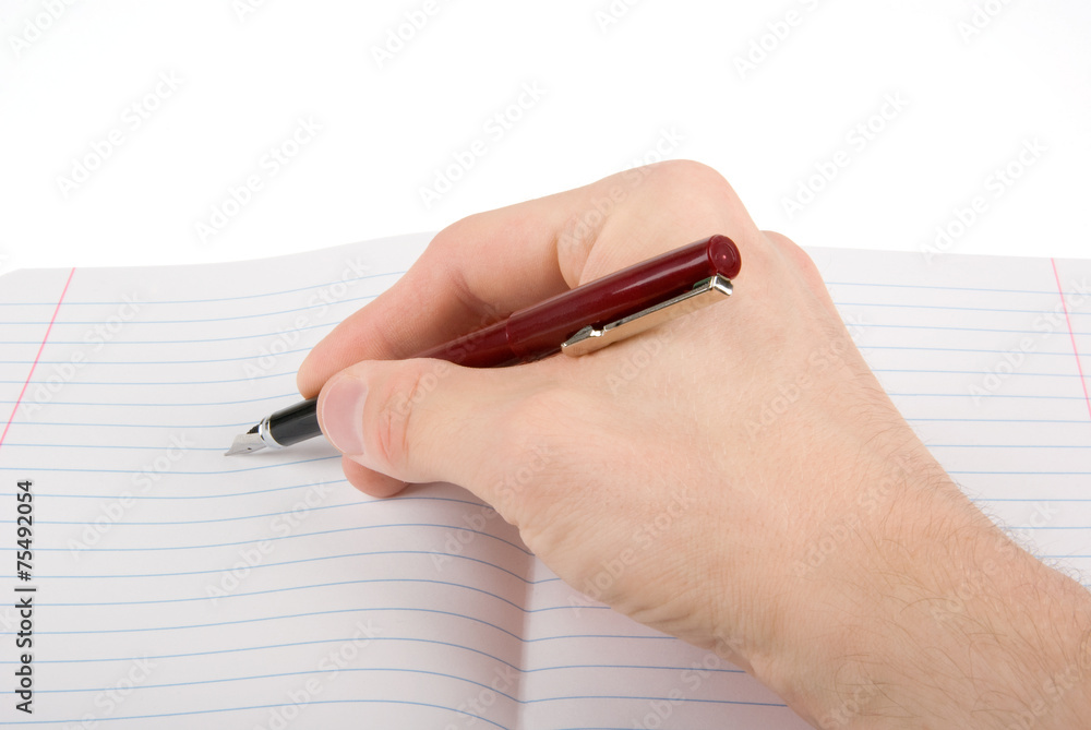 Hand writing on empty notepad (notebook) isolated on white Hand writing on empty notepad (notebook) isolated on white
