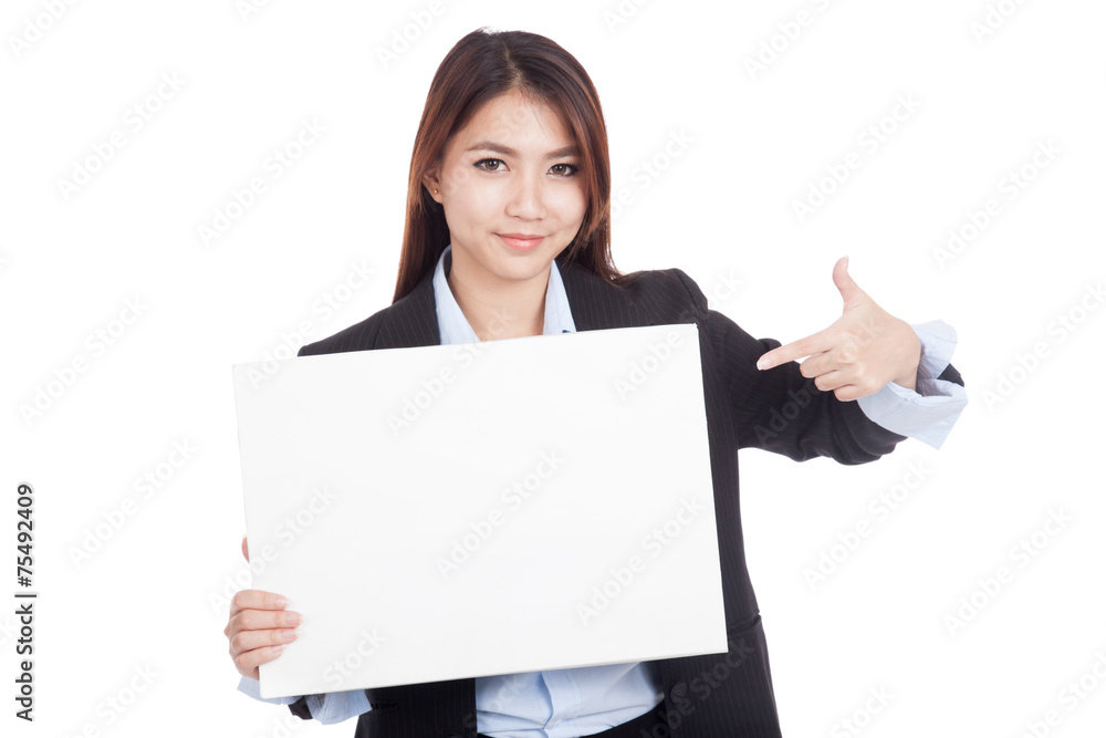 Young Asian businesswoman point to blank sign Young Asian businesswoman point to blank sign