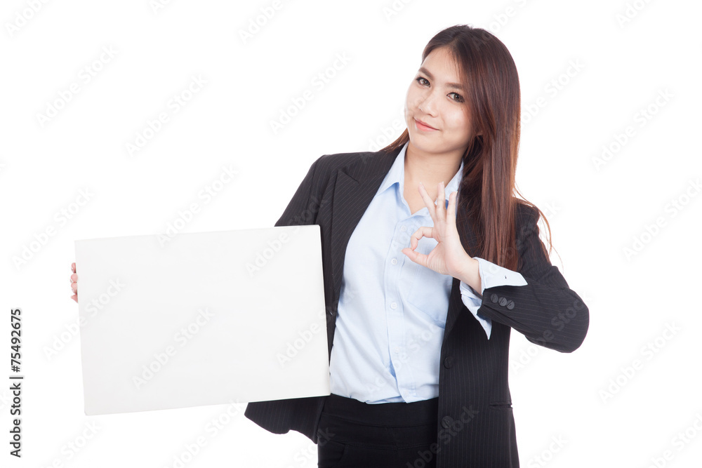 Young Asian businesswoman show OK with blank sign Young Asian businesswoman show OK with blank sign