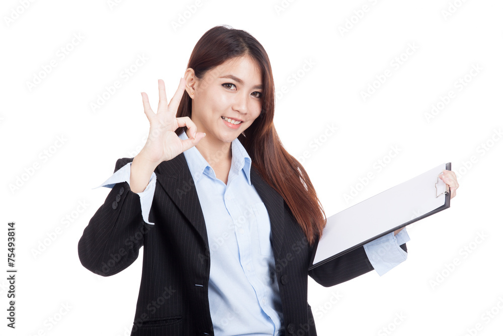 Young Asian businesswoman OK with clipboard Young Asian businesswoman OK with clipboard