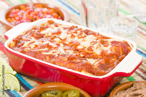 Enchiladas - Mexican tortilla with chorizo and chicken. photo