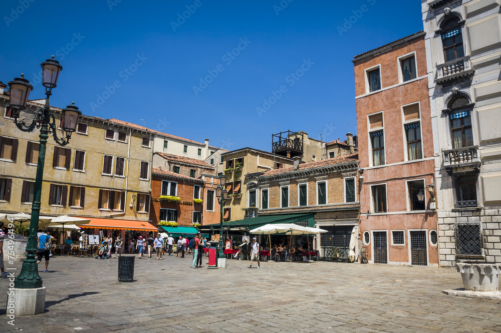 street in historic Venice, Italy with beautiful monument