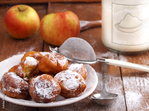 Homemade fritters on wooden background photo