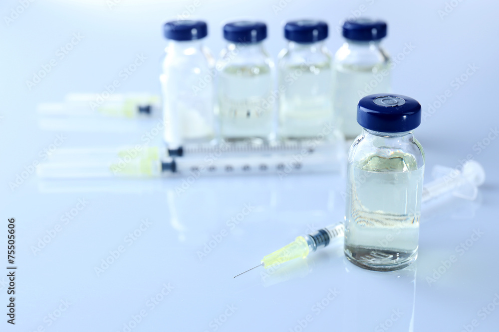 Vaccine in vial with syringe Vaccine in vial with syringe