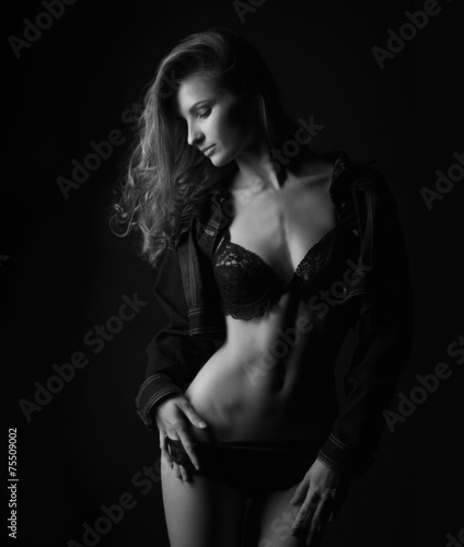 silhouette of a sexy woman in the lower black lingerie