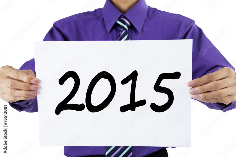 Entrepreneur holding number 2015 on a paper Entrepreneur holding number 2015 on a paper