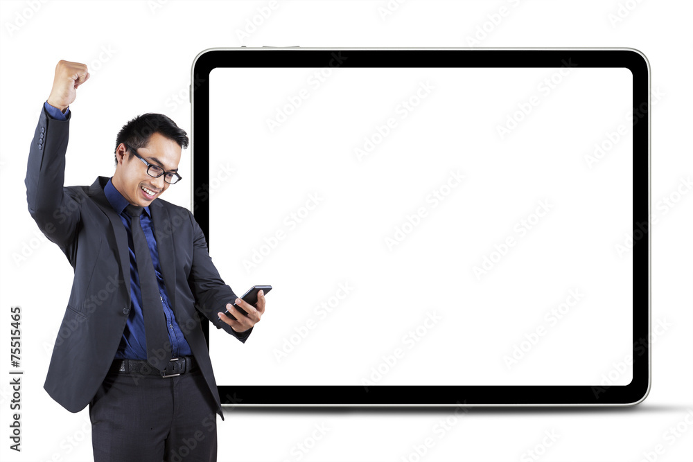 Successful male entrepreneur reading good news Successful male entrepreneur reading good news
