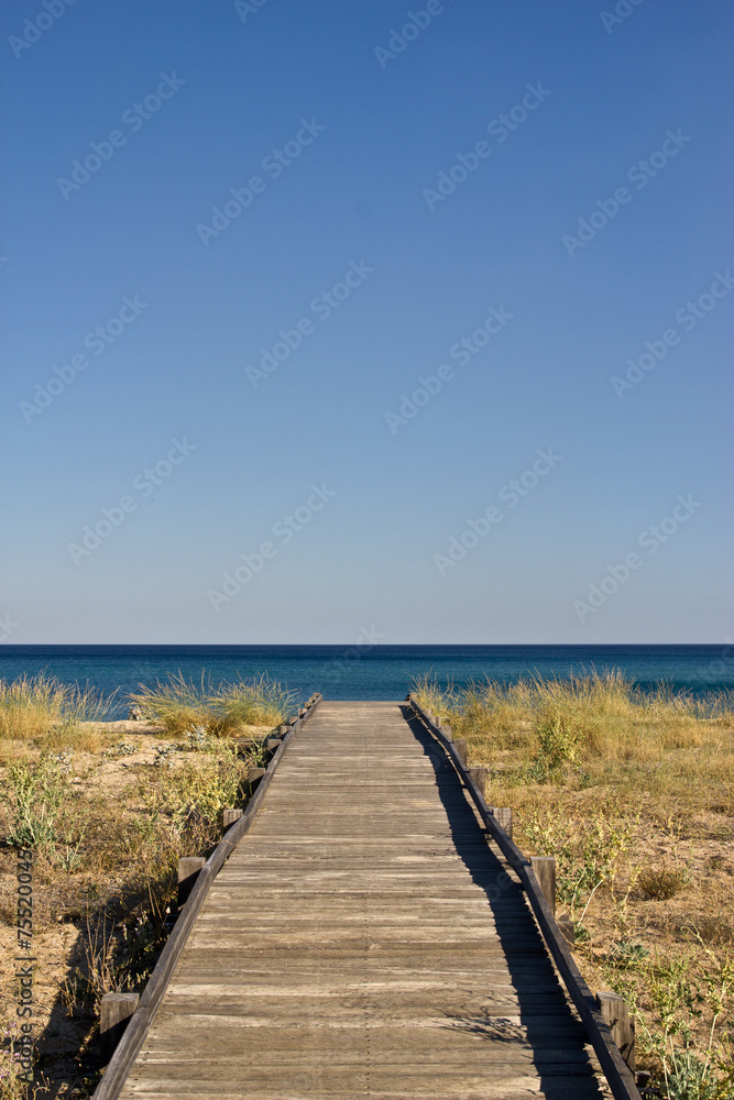 Footbridge on a desert beach in the morning Footbridge on a desert beach in the morning