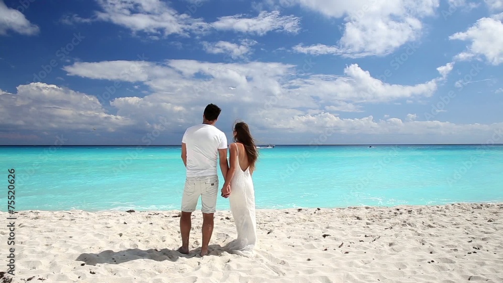 Young beautiful newlyweds on white sandy beach Young beautiful newlyweds on white sandy beach