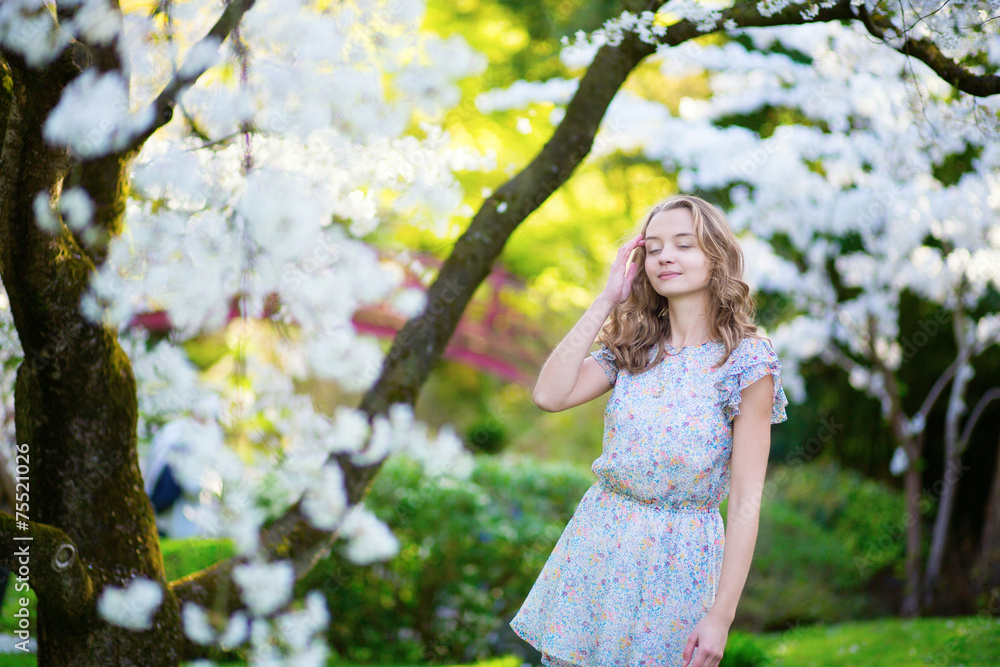 Beautiful girl in cherry blossom garden Beautiful girl in cherry blossom garden