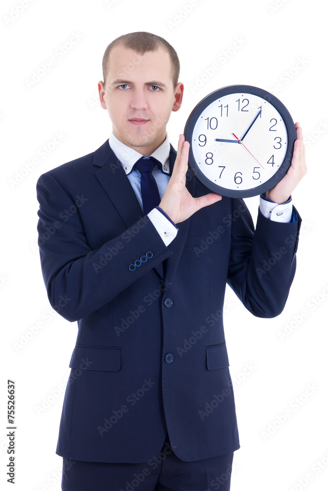 young man in business suit holding office clock isolated on whit young man in business suit holding office clock isolated on whit