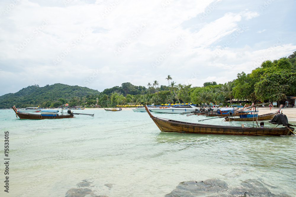 Traditional longtail boat in bay on Phi Phi Island, Krabi Traditional longtail boat in bay on Phi Phi Island, Krabi