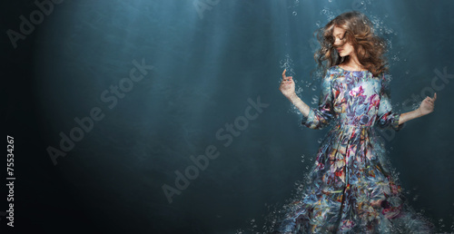 Immersion. Woman in Deep  Blue Sea. Fantasy