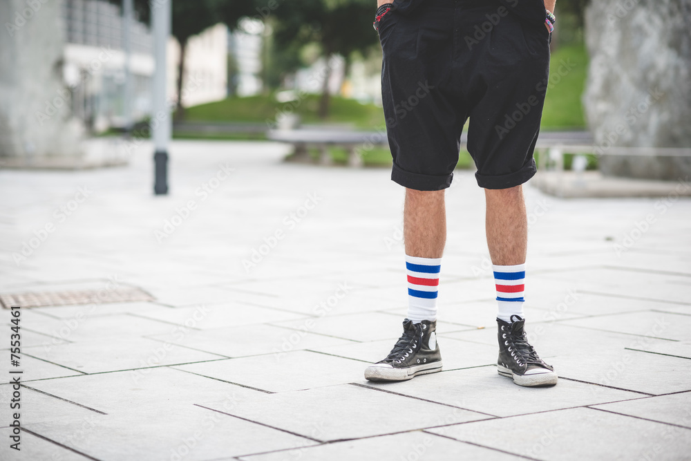 close up legs young handsome bearded hipster man close up legs young handsome bearded hipster man