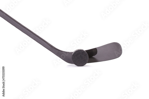 Photography Black ice hockey stick and puck.