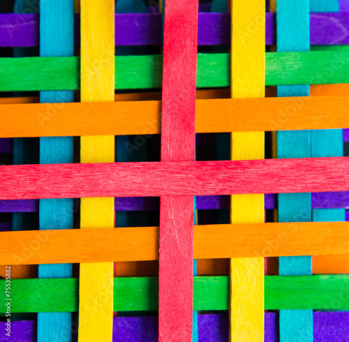 Colorful stripes wooden lay by sequence layer on black board