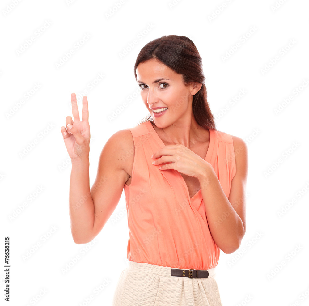 Stylish brunette lady making a victory sign Stylish brunette lady making a victory sign