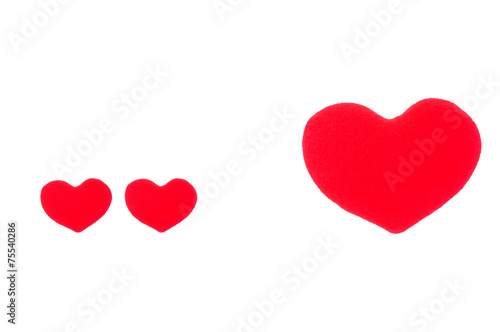 A small red heart and a big red heart on a white background