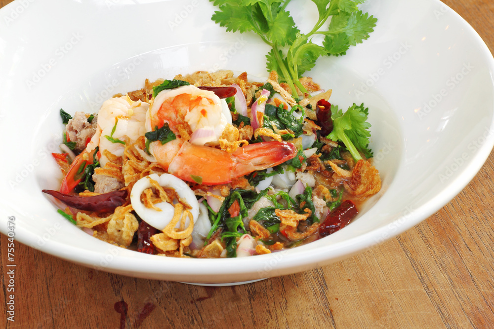 close up thai spicy seafood salad in ceramic dish close up thai spicy seafood salad in ceramic dish
