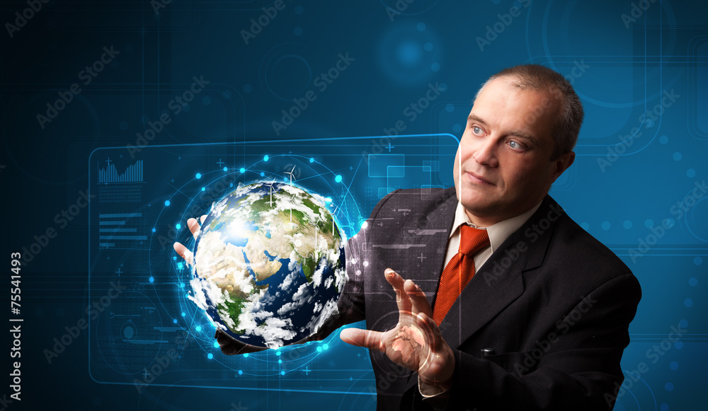 Businessman touching high-tech 3d earth panel Businessman touching high-tech 3d earth panel
