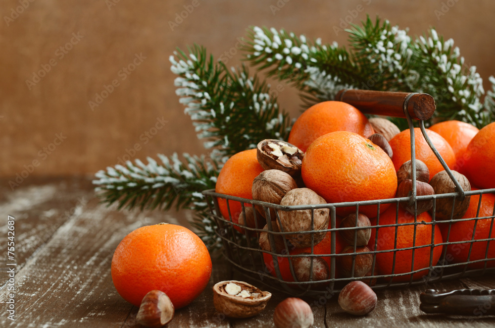 Xmas decoration with tangerines with copy space on wood Xmas decoration with tangerines with copy space on wood