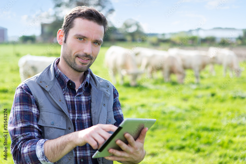Young attractive farmer working in a field Young attractive farmer working in a field