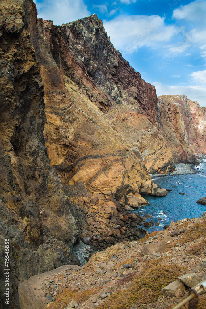 Yellow-red rocks on an ocean coast, Madeira, Portugal