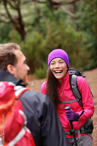 Couple having fun laughing hiking in forest © Maridav