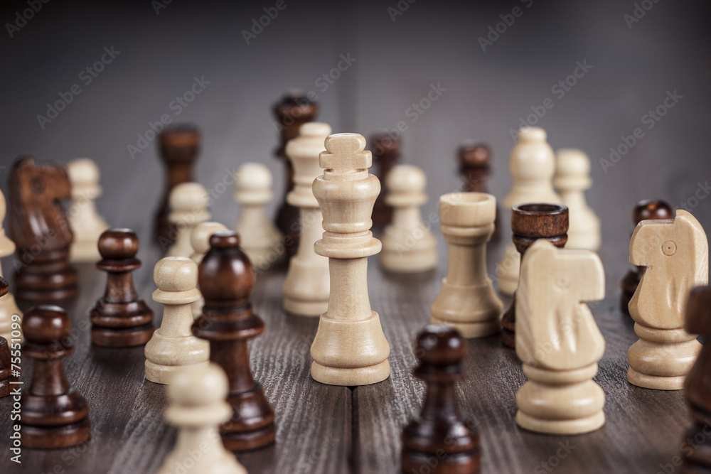 chess figures on the wooden table chess figures on the wooden table