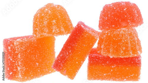 Handful of red and orange candy close up