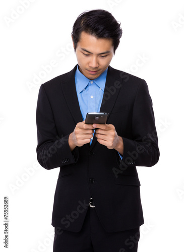 Businessman look at mobile phone © leungchopan