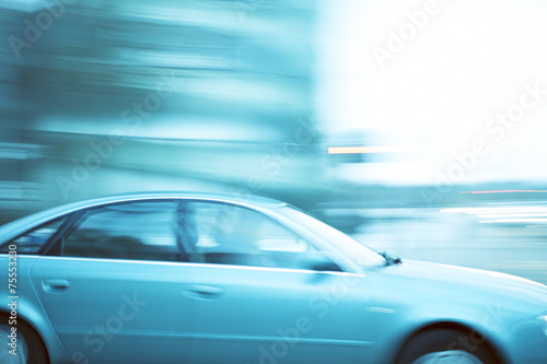 Cars driving fast in city