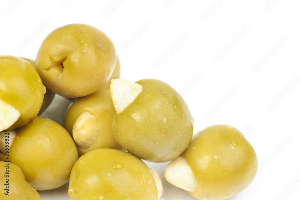 Green olives stuffed with almonds isolated on white background Green olives stuffed with almonds isolated on white background
