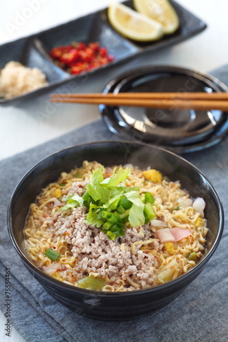 Egg noodles spicy soup with pork and vegetable