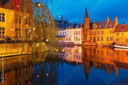 Cityscape with a tower Belfort from Rozenhoedkaai in Bruges at s photo