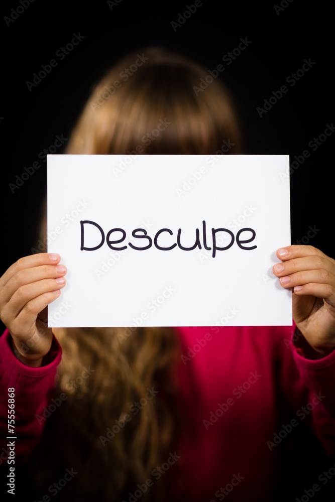 Child holding sign with Portuguese word Desculpe - Sorry Child holding sign with Portuguese word Desculpe - Sorry