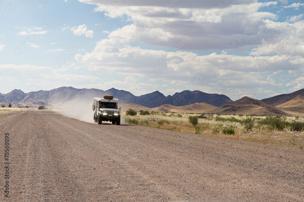 Driving in a dirt road, Namibia Driving in a dirt road, Namibia