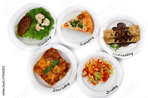 Daily menu. Plates with food on table