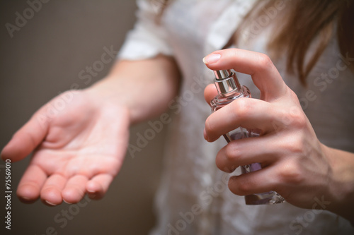Woman hands perfume bottle