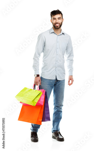 Handsome man holding shopping bags