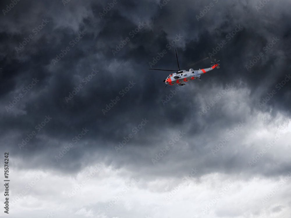 Helicopter in Norway seen from below in front dramatic sky Helicopter in Norway seen from below in front dramatic sky