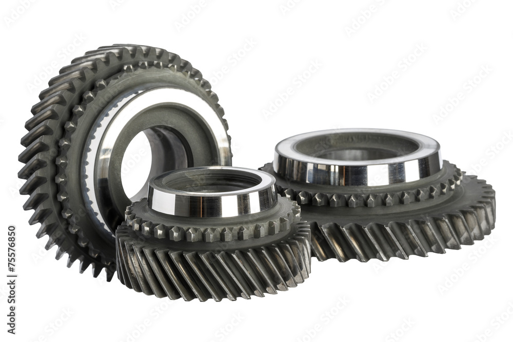 Three worn cog wheels Three worn cog wheels