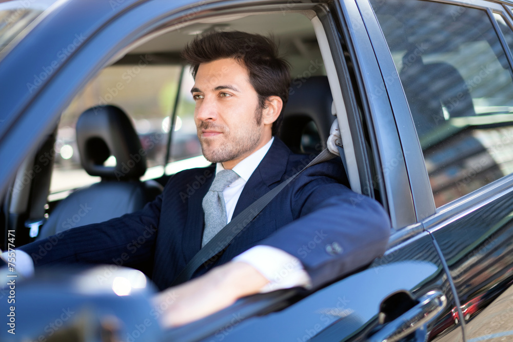 Handsome man driving his car