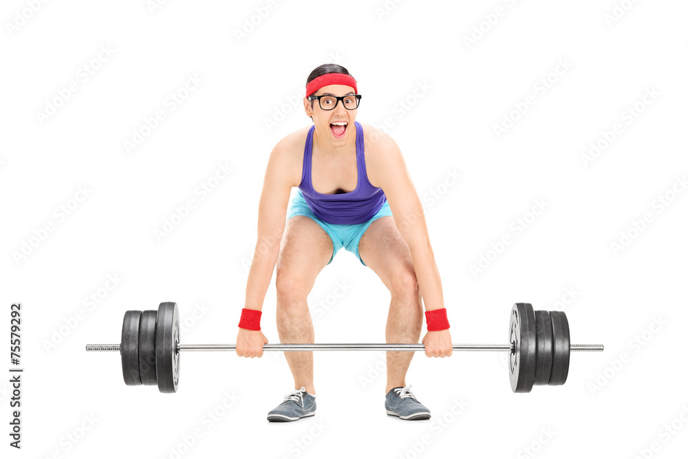 Cheerful young man exercising with a weight Cheerful young man exercising with a weight