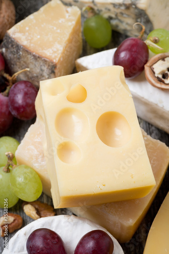 Maasdam cheese and grapes, close-up, top view