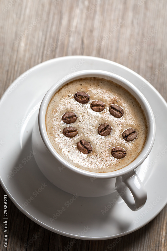White coffee cup on wooden background. White coffee cup on wooden background.