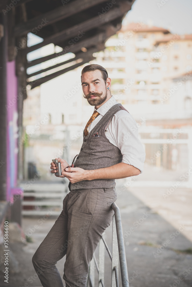 Fototapeta premium handsome big moustache hipster man smoking pipe