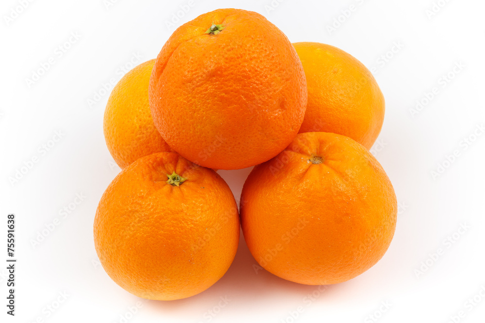 Oranges stacked as pyramid with white background Oranges stacked as pyramid with white background